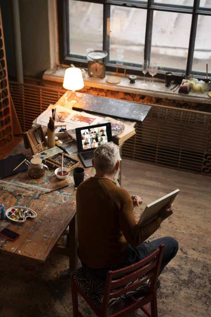 full shot man painting indoors